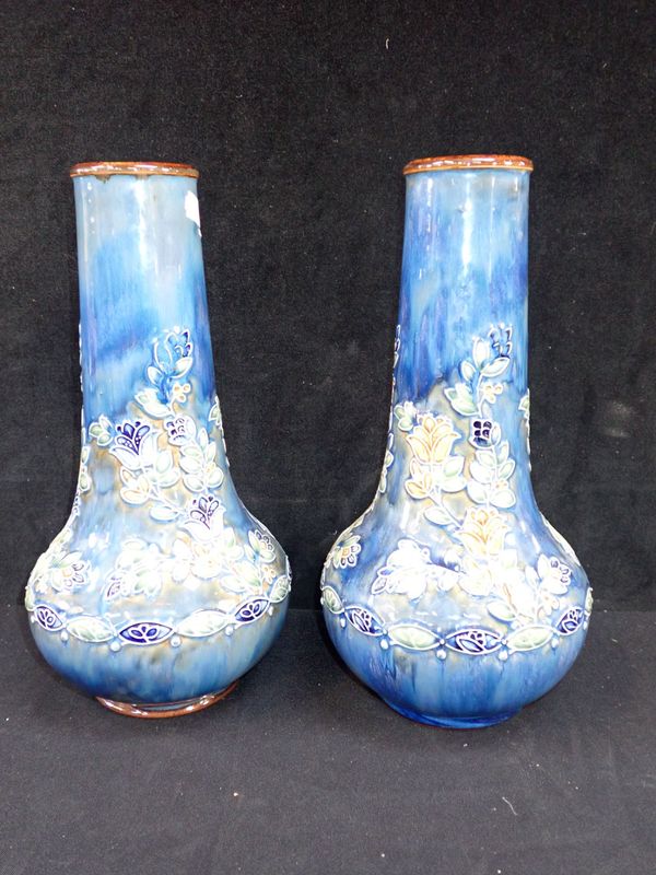 A PAIR OF ROYAL DOULTON VASES WITH RAISED-LINED FLORAL DECORATION