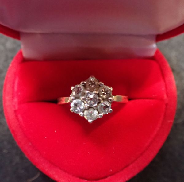 A DIAMOND DAISY RING