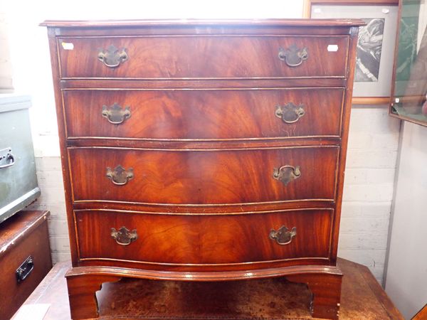 A REPRODUCTION FIGURED MAHOGANY SERPENTINE CHEST OF DRAWERS