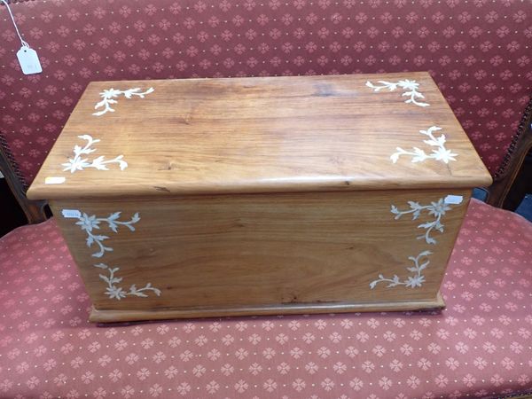 A SMALL TEAK TRUNK WITH MOTHER-OF-PEARL INLAY