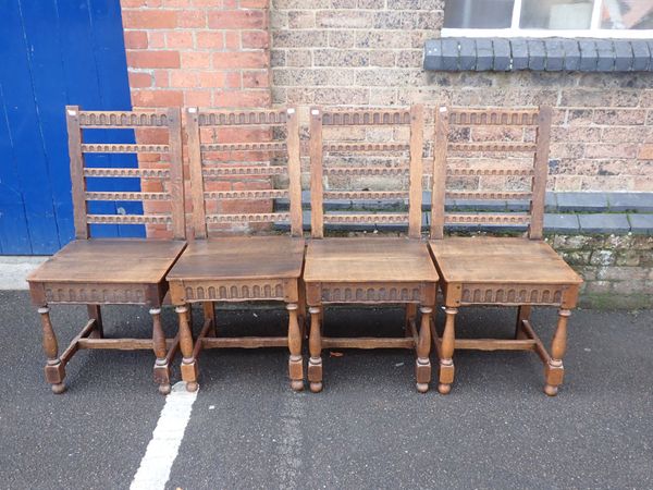 A SET OF FOUR OAK DINING CHAIRS