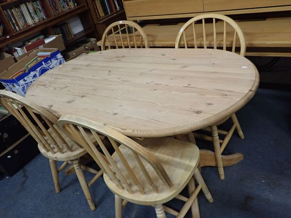 A COUNTRY STYLE PINE DINING TABLE