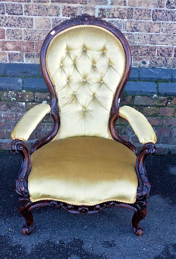 A VICTORIAN WALNUT  UPHOLSTERED ARMCHAIR