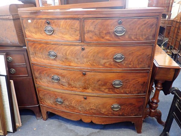 A GEORGE IV FIGURED MAHOGANY BOWFRONT CHEST OF DRAWERS