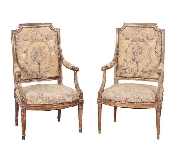 A PAIR OF LOUIS XVI STYLE GILTWOOD ARMCHAIRS