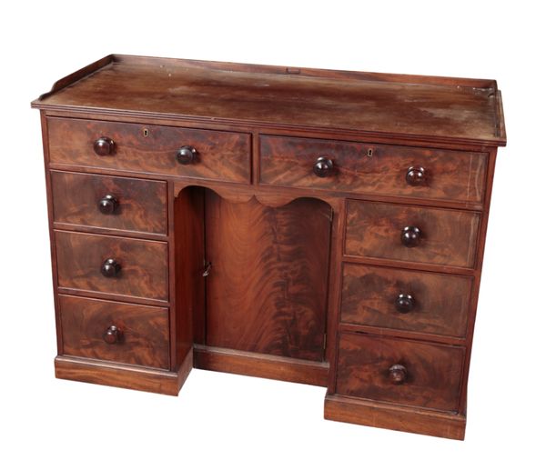 A VICTORIAN MAHOGANY KNEEHOLE DESK