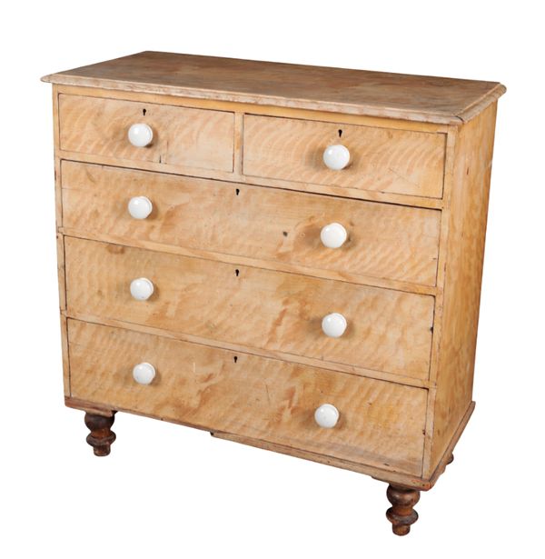 A SCUMBLED PINE CHEST OF DRAWERS