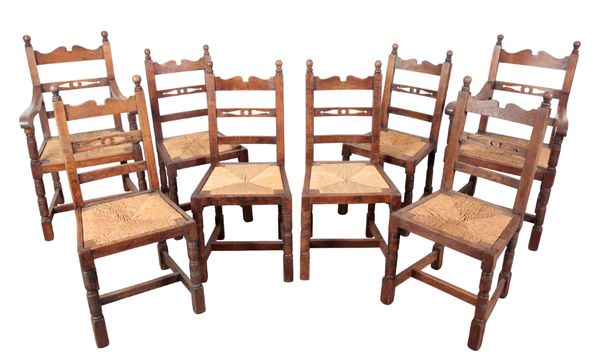 A SET OF EIGHT OAK DINING CHAIRS