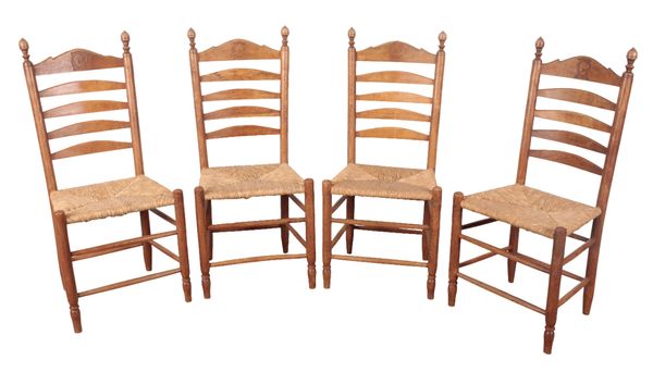 A SET OF FOUR CONTINENTAL LADDER BACK CHAIRS