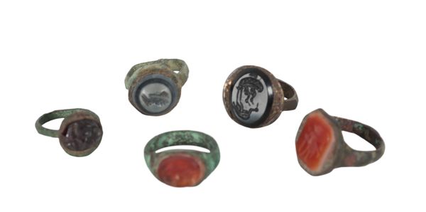 A COLLECTION OF FIVE ROMAN STYLE BRONZE RINGS