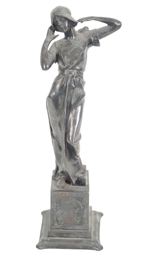 A SILVERED FIGURE OF A WOMAN