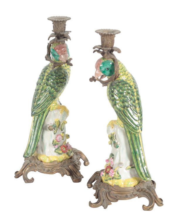 A PAIR OF PORCELAIN AND GILT METAL MOUNTED CANDLESTICKS