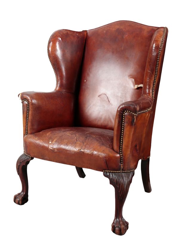 A MAHOGANY WING ARMCHAIR