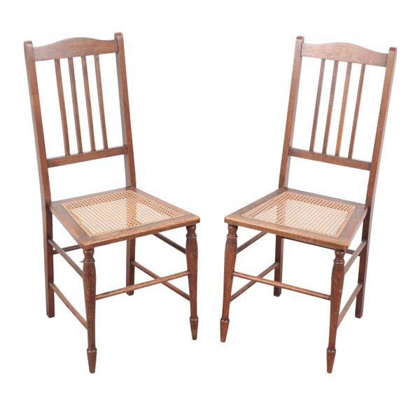 A PAIR OF EDWARDIAN OAK BEDROOM CHAIRS OF ARTS & CRAFTS DESIGN