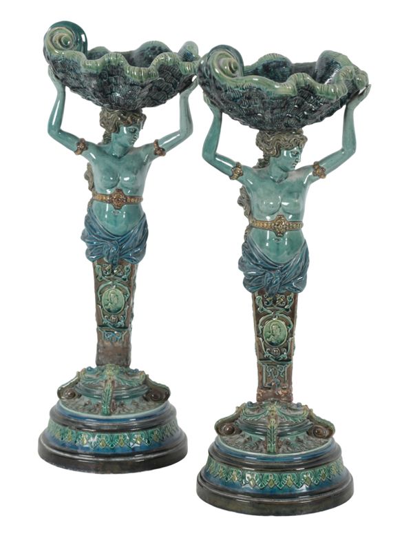 A PAIR OF CONTINENTAL MAJOLICA FIGURAL TAZZAS