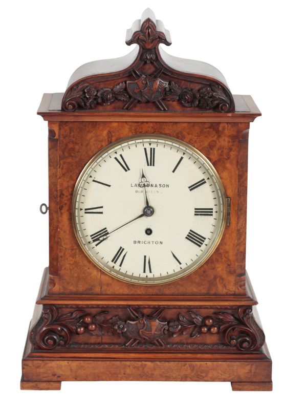 A VICTORIAN WALNUT MANTLE CLOCK