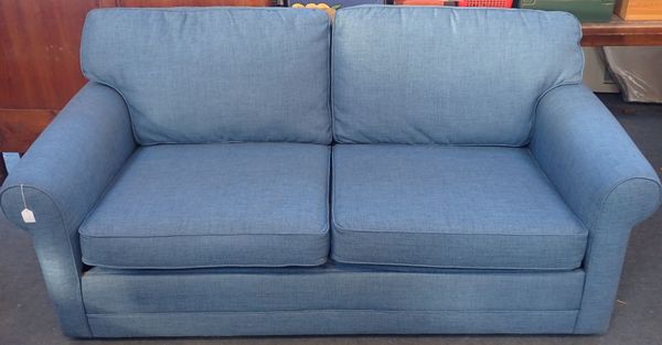 A MODERN SOFA BED, WITH BLUE UPHOLSTERY