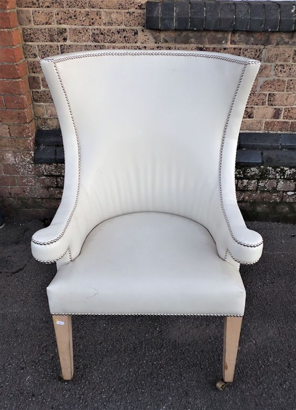 A WHITE LEATHER UPHOLSTERED ARMCAIR