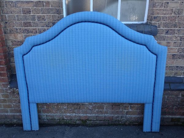 AN UPHOLSTERED DOUBLE HEADBOARD, IN PALE BLUE CHECK