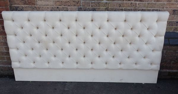 A CREAM BUTTONED SUEDE  DOUBLE HEADBOARD