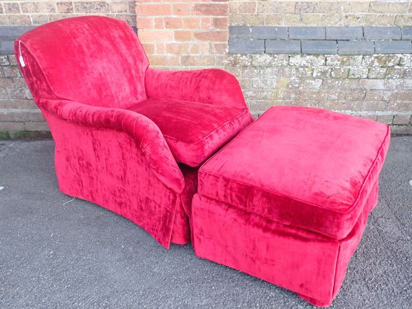 A RED VELVET UPHOLSTERED EASY CHAIR