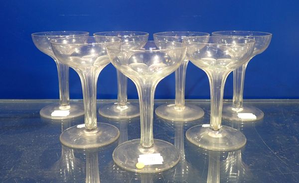 A GROUP OF HOLLOW-STEM CHAMPAGNE GLASSES