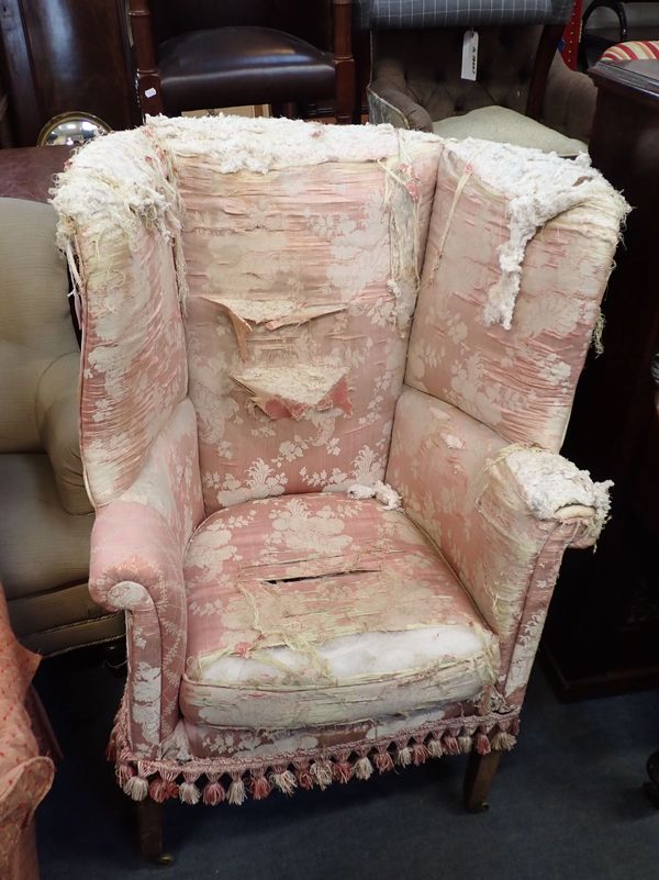 A GEORGE III STYLE BARREL-BACK ARMCHAIR