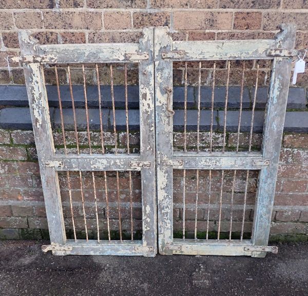 A PAIR OF WOOD AND IRON GATES
