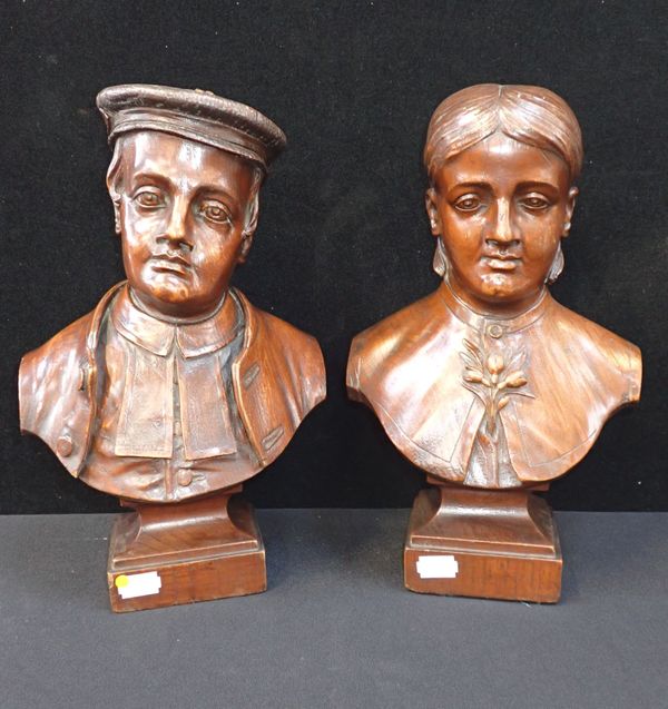 A PAIR OF CARVED ELM BUSTS