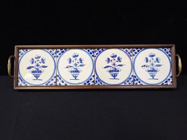 FOUR TIN-GLAZE TILES, FITTED AS A TRAY