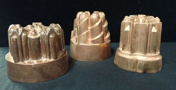 THREE COPPER FOOD MOULDS