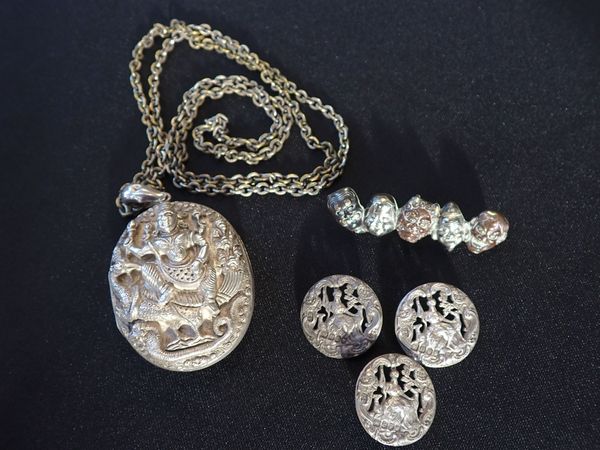 AN INDIAN 'KUTCH' STYLE WHITE METAL LOCKET