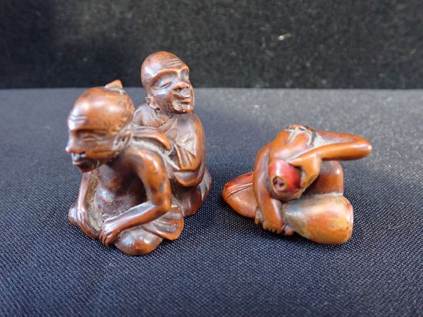 TWO JAPANESE CARVED WOODEN NETSUKE