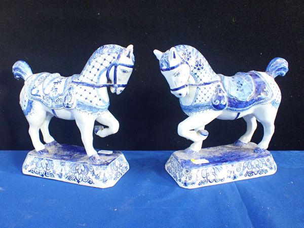 A  MATCHED PAIR OF DUTCH DELFT HORSES