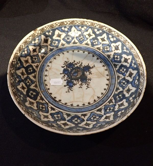 A PERSIAN POTTERY PLATE