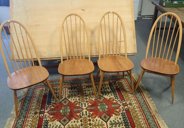 A SET OF FOUR ERCOL ELM HOOP BACK DINING CHAIRS