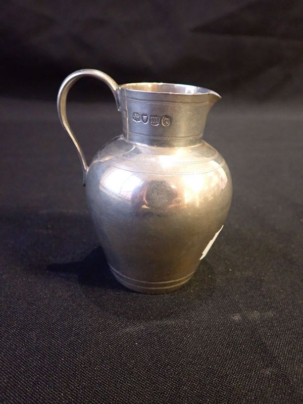 A VICTORIAN SILVER CREAM JUG