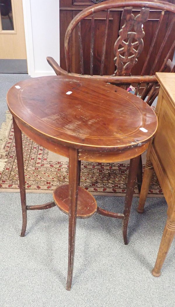 AN EDWARDIAN MAHOGANY OVAL TWO TIER OCCASIONAL TABLE