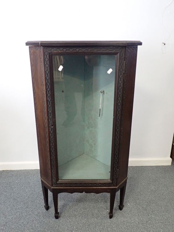 A MAHOGANY BLIND FRET DECORATED CORNER CABINET