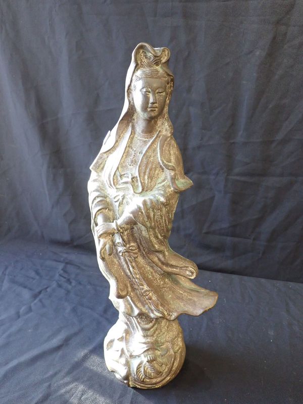 A CAST BRONZE FIGURE OF GUANYIN