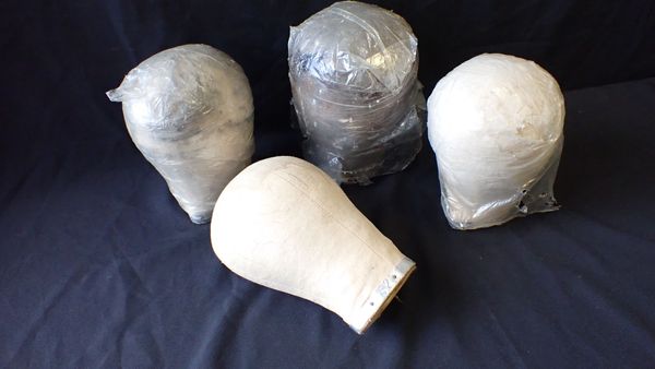 A COLLECTION OF FOUR MANNEQUIN HEADS, EARLY 20TH CENTURY