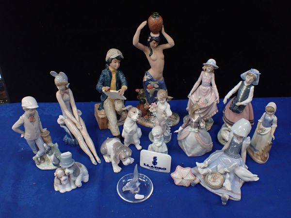 A LALIQUE RING HOLDER AND A QUANTITY OF LLADRO AND NAO FIGURES