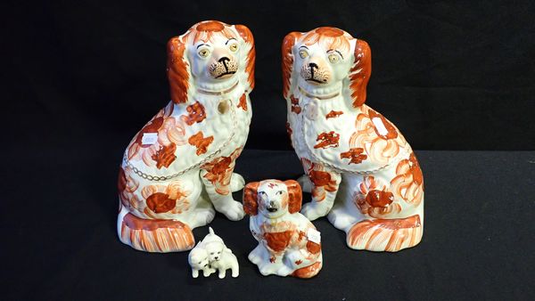 A PAIR OF STAFFORDSHIRE DOGS