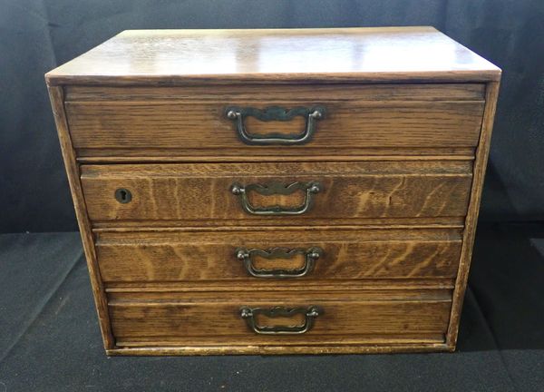 AN EDWARDIAN OAK FOUR-DRAWER FILING CHEST