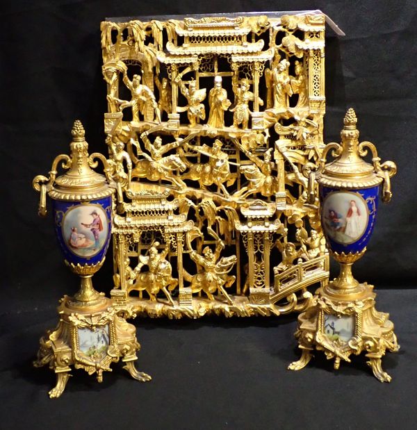 A PAIR OF GILT METAL AND PORCELAIN GARNITURE