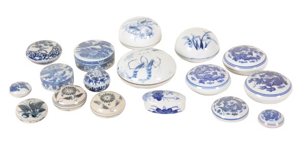 A COLLECTION OF SEVENTEEN CHINESE AND JAPANESE BLUE AND WHITE PORCELAIN BOXES