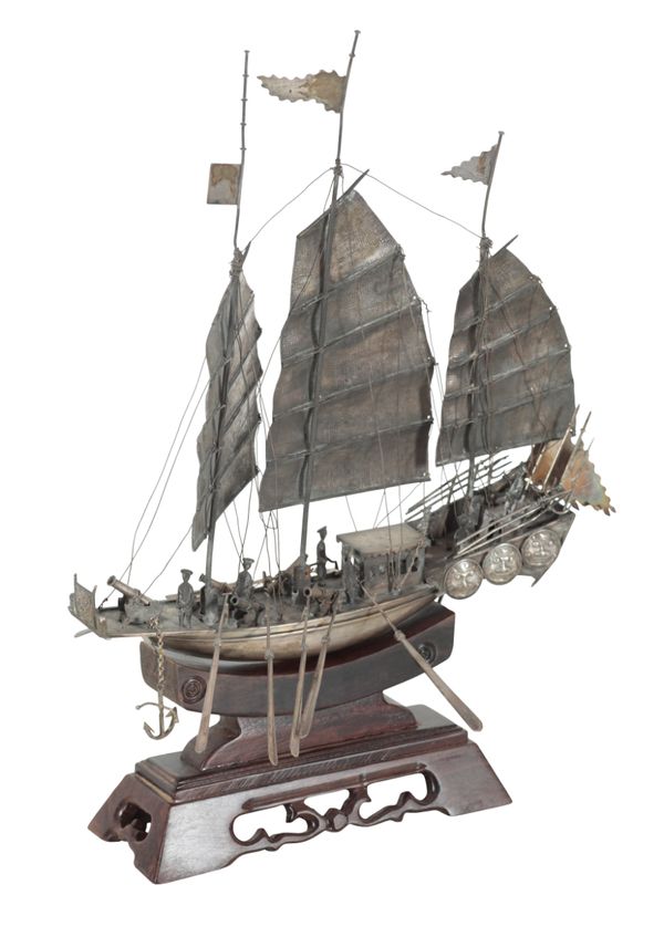 A CHINESE WHITE METAL MODEL OF A THREE MASTED JUNK