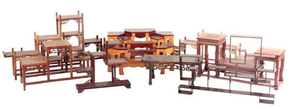 A GROUP OF NINE CHINESE WOODEN STANDS