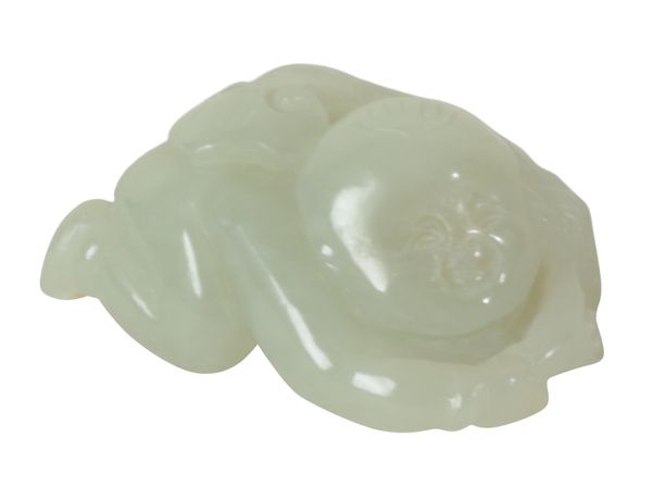 A CHINESE PALE CELADON JADE CARVING OF A BOY