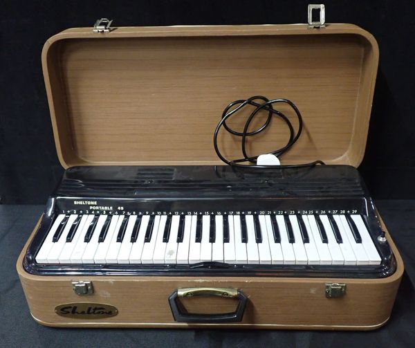 A SHELTONE 49 PORTABLE KEYBOARD